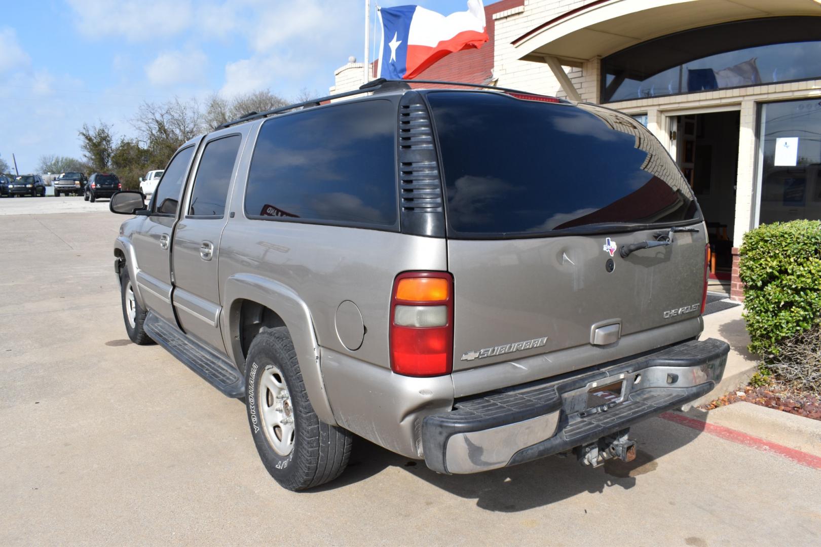 2003 Gold /Tan Chevrolet Suburban (1GNEC16Z23J) with an V8, 5.3.0L engine, 4 SPEED AUTOMATIC transmission, located at 5925 E. BELKNAP ST., HALTOM CITY, TX, 76117, (817) 834-4222, 32.803799, -97.259003 - Buying a 2003 Chevrolet Suburban can offer several benefits, including: Spaciousness: The Suburban is known for its ample interior space, making it great for large families, hauling cargo, or even converting into a camper. Towing Capacity: It's equipped with a robust engine and frame, allowing it - Photo#2